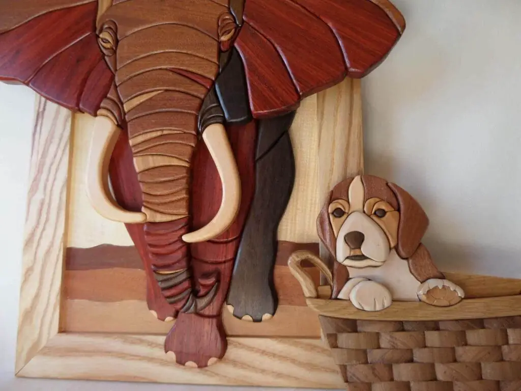 Intarsia design of elephant and dog wall art