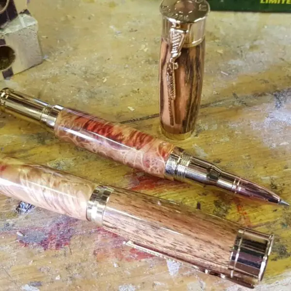 two rollerballs on bench