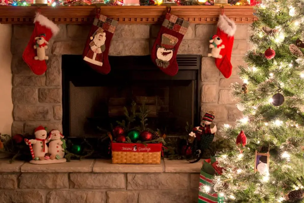 christmas stockings hanging over a fireplace